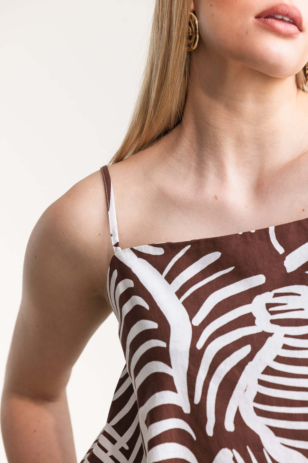 Model wearing the Jesca Cami Top featuring a relaxed fit and adjustable straps, showcasing a stylish print.