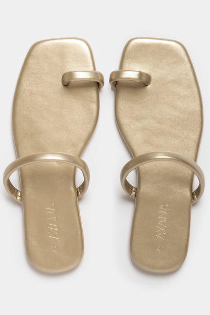 Fera Slide-In Sandals in gold with flat toe-post design and single vamp strap for chic summer style.