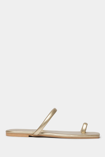 Fera Slide-In Sandals with a gold tone and sleek toe-post design, perfect for chic comfort.