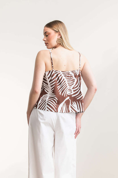 A model wearing the Jesca Cami Top with a breezy printed design and adjustable shoulder straps, showcasing a relaxed fit.